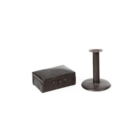 A small iron box, 12cm wide and a candlestick, 12cm high