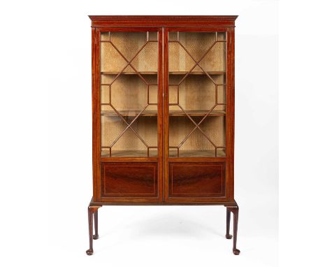 An Edwardian mahogany and inlaid display cabinet, enclosed by glazed panel doors on cabriole legs, 111cm wide, 37cm deep, 182