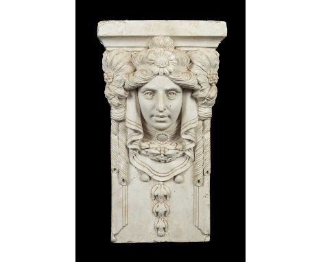 A Neoclassical plaster cast capital of a female mask with flowers in her hair, 53cm high x 31cm wide