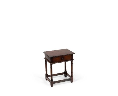 A 17th Century style oak side table fitted with a single drawer, 55cm wide, 39cm deep, 65cm high