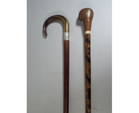 A Silver Mounted Horn Handled Walking Stick and A Horn Handled Walking Cane. 