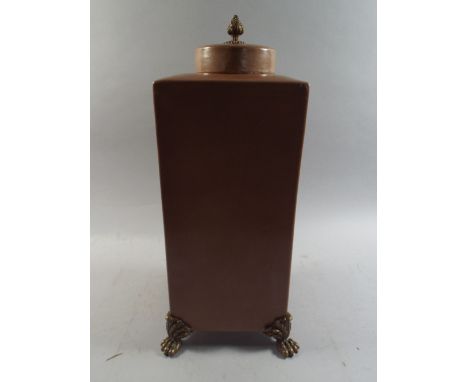 A Ceramic Casket with Ormolu Claw Feet and Finial. 