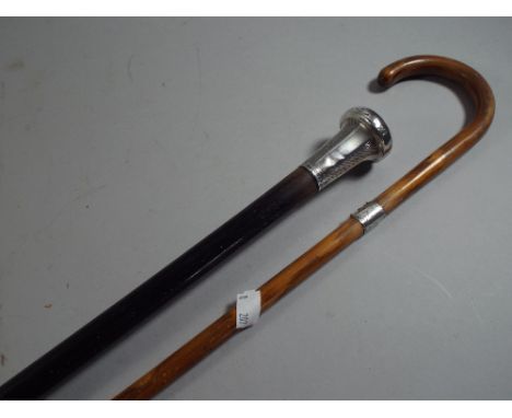 An Ebonised Silver Topped Walking Cane and A Silver Mounted Child's Walking Stick. 