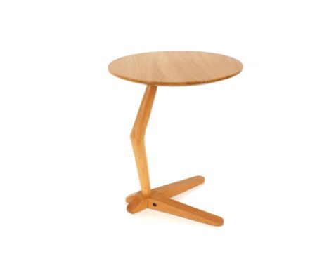 An Ercol light occasional table, having circular top, shaped column and V shaped base, 43cm dia. x 50cm high 