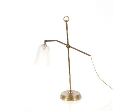 An Art Deco brass adjustable table lamp with frosted foliate and shell moulded glass shade