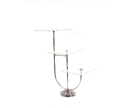 An Art Deco style chrome and plastic graduated three tier shop display, 62cm high 
