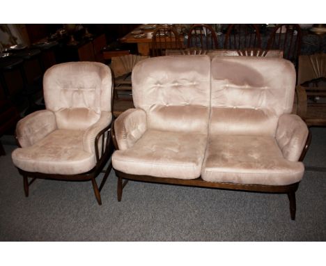 An Ercol cottage style two seat settee and matching armchair 