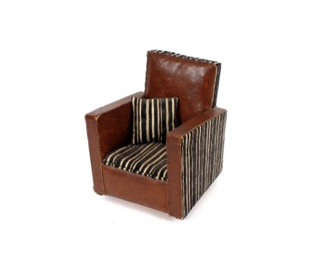 An Art Deco child's chair with leatherette and striped upholstery