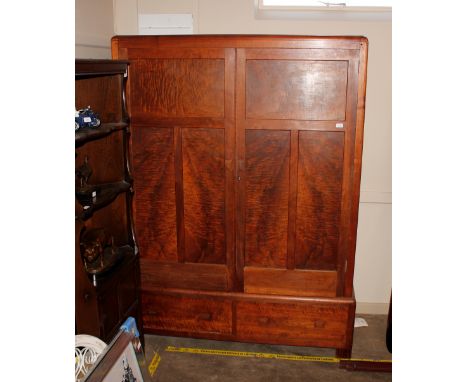An Art Deco mahogany and pine press cupboard, hand written label to the interior "Token Hand Furniture Designed by Betty Joel