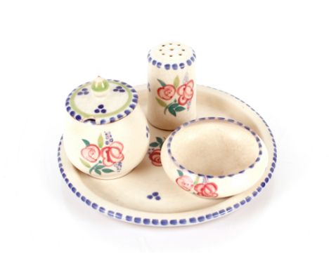 A Poole pottery four piece cruet set 