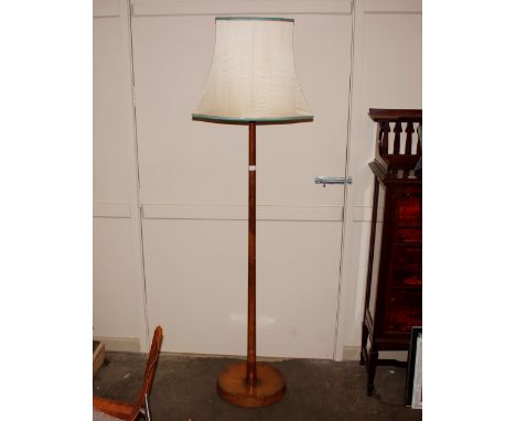 A mid-20th Century walnut standard lamp and shade 