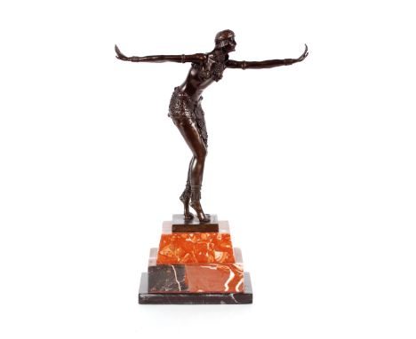 An Art Deco style bronze figure of a dancing girl, raised on stepped marble plinth