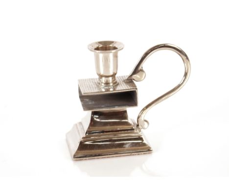 An Art Deco design chrome plated candlestick and matchbox holder, 11cm high 