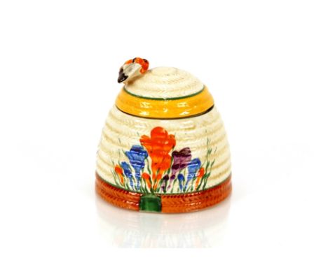 A Clarice Cliff "Crocus" pattern preserve jar, the lid with bee finial