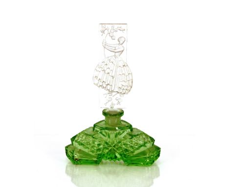 An Art Deco green glass scent bottle, the clear glass stopper decorated with a lady in crinoline dress