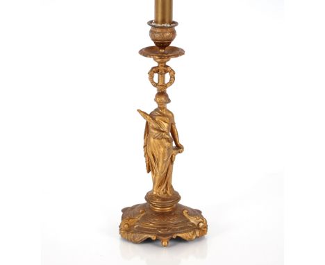 A 19th Century gilded candlestick in the form of a figure of a maiden, 28cm high 