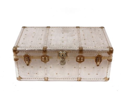 A polished metal aviation style large trunk, flanked by leather handles, 97cm wide