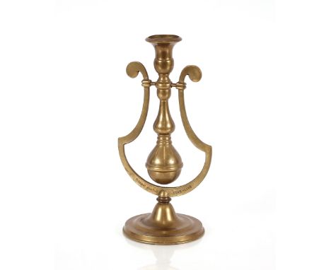 A decorated brass gimballed candlestick, bears stamp referring to Titanic and White Star Line, 28cm high 