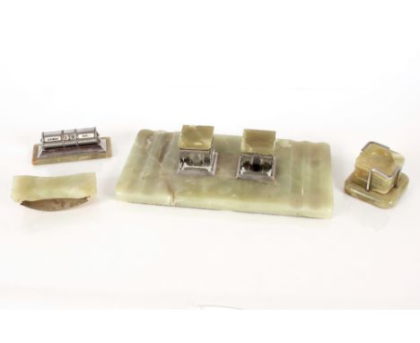 An Art Deco green onyx and chrome mounted desk set, including perpetual calendar, ash trays and rocking blotter