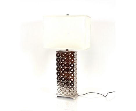 A modern chrome lamp with pierce roundel decoration and white silk shade, 90cm high overall