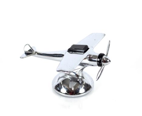 An Art Deco design chrome table lighter in the form of a vintage aeroplane 