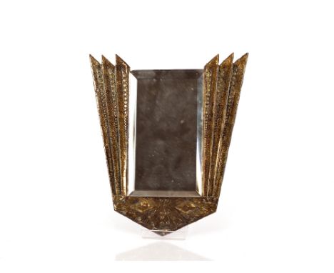 An Art Deco brass mounted wall mirror, with stylised design and bevelled plate