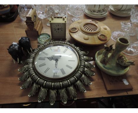 A miscellaneous selection including a treen bowl, carriage clock, novelty cigarette dispenser, wall clock etc