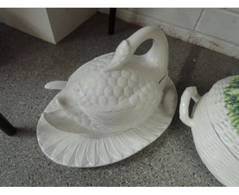 A decorative ceramic swan tureen, spoon  and platter