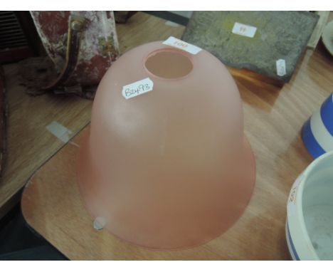 A pink glass light shade