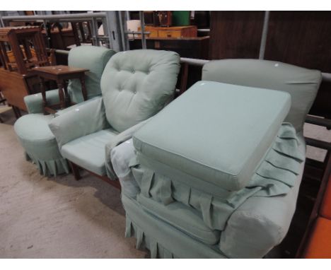 A selection of easy chairs including Ercol style