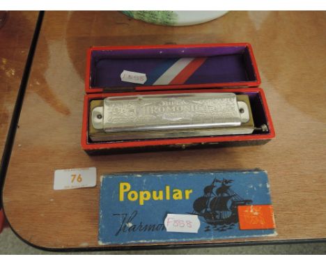 A Hohner Chromatic Harmonica and a Popular Delicia Harmonica