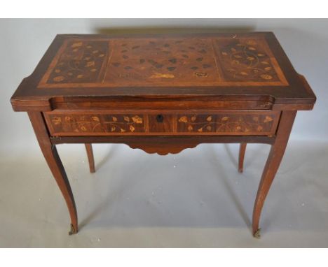 A French Kingwood and Marquetry Inlaid Card Table, the hinged top above a marquetry inlaid frieze drawer with shaped apron, r