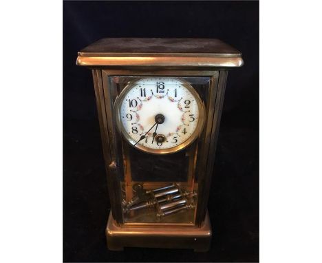A Brass mantle clock with enamel face
