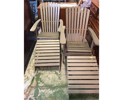 Two steamer chairs with foot stools in light grey