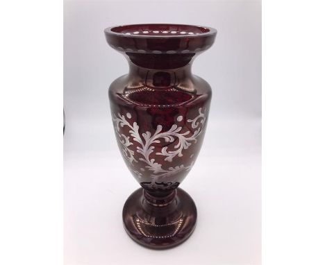 A 10th Century ruby Bohemian overlay glass trophy shaped vase