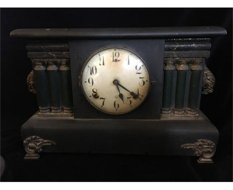 A wooden American mantle clock.