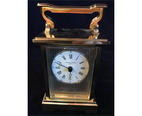 A Carriage Clock in brass with a hallmarked silver face. Rency Anglaise by Taylor Bligh No 10 of a limited edition of 100.