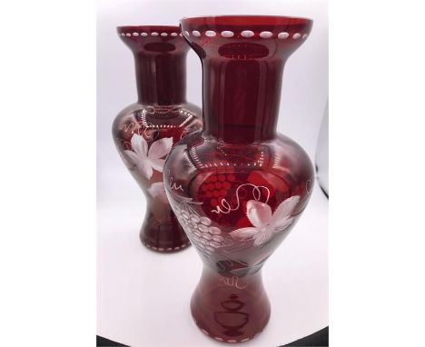 A pair of mid 19th Century Bohemian ruby glas vases engraved with vine and grapes.
