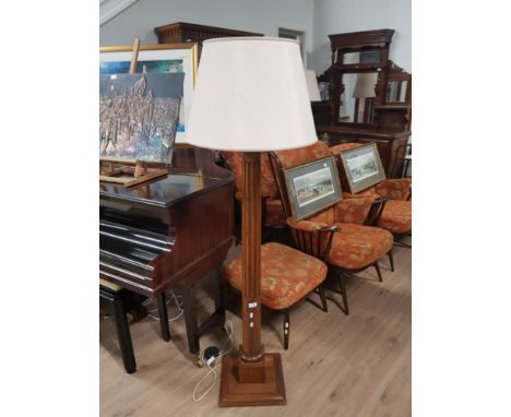 A SOLID OAK STANDARD LAMP