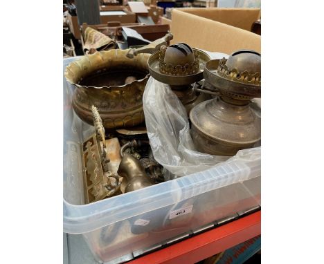 A box of various brassware to include mirror, oil lamps and door knockers etc. 