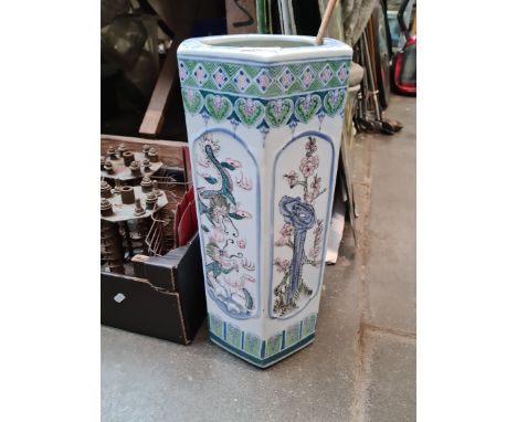 An Oriental ceramic stick stand. 