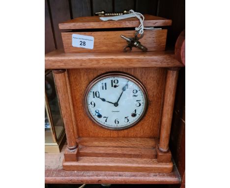 An early 20th century mantel clock, by William L. Gilbert, Winsted company, USA, in silky oak case, with key and weight. 