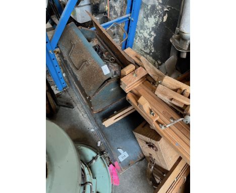 A metal toolbox with tools and an empty wooden box. 