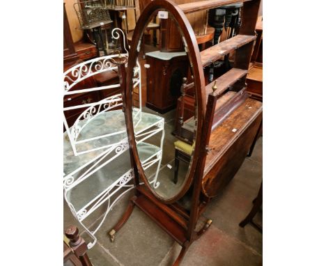 An early 20th century mahogany cheval mirror.Condition:- General wear through age, some small areas of silvering to mirror, s