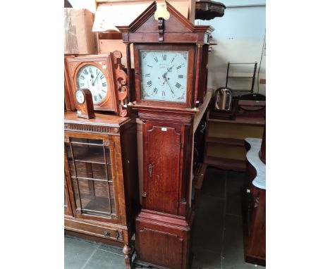 A Georgian oak cased 8 day grandfather clock with enamel dial, the dial being decorated with flowers and marked Houghton, Cho