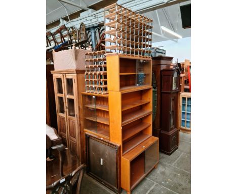 Various items of furniture; three teak bookcases, metal and wooden wine racks, a folding card table and a Lloyd Loom ottoman.