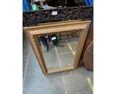 A black forest wood framed mirror and a gilt framed mirrorCondition:- General wear through age and use, some marks to both, m