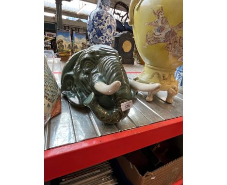 An elephant pottery wall pocket, length 35cm.Small chip to one of the tusks, no other issues with this item.