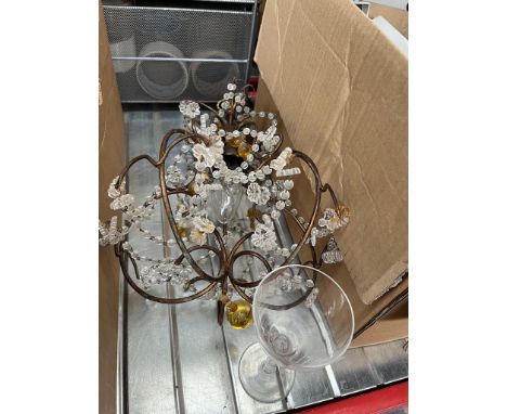 A metal light fitting with glass beads / droplets. 