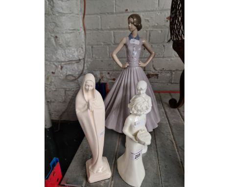 A large Nao figure, pair of Royal Worcester figures and another figure.